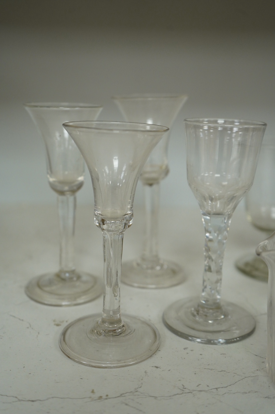 A collection of seven 18th century drinking glasses and a rinser. Condition - good